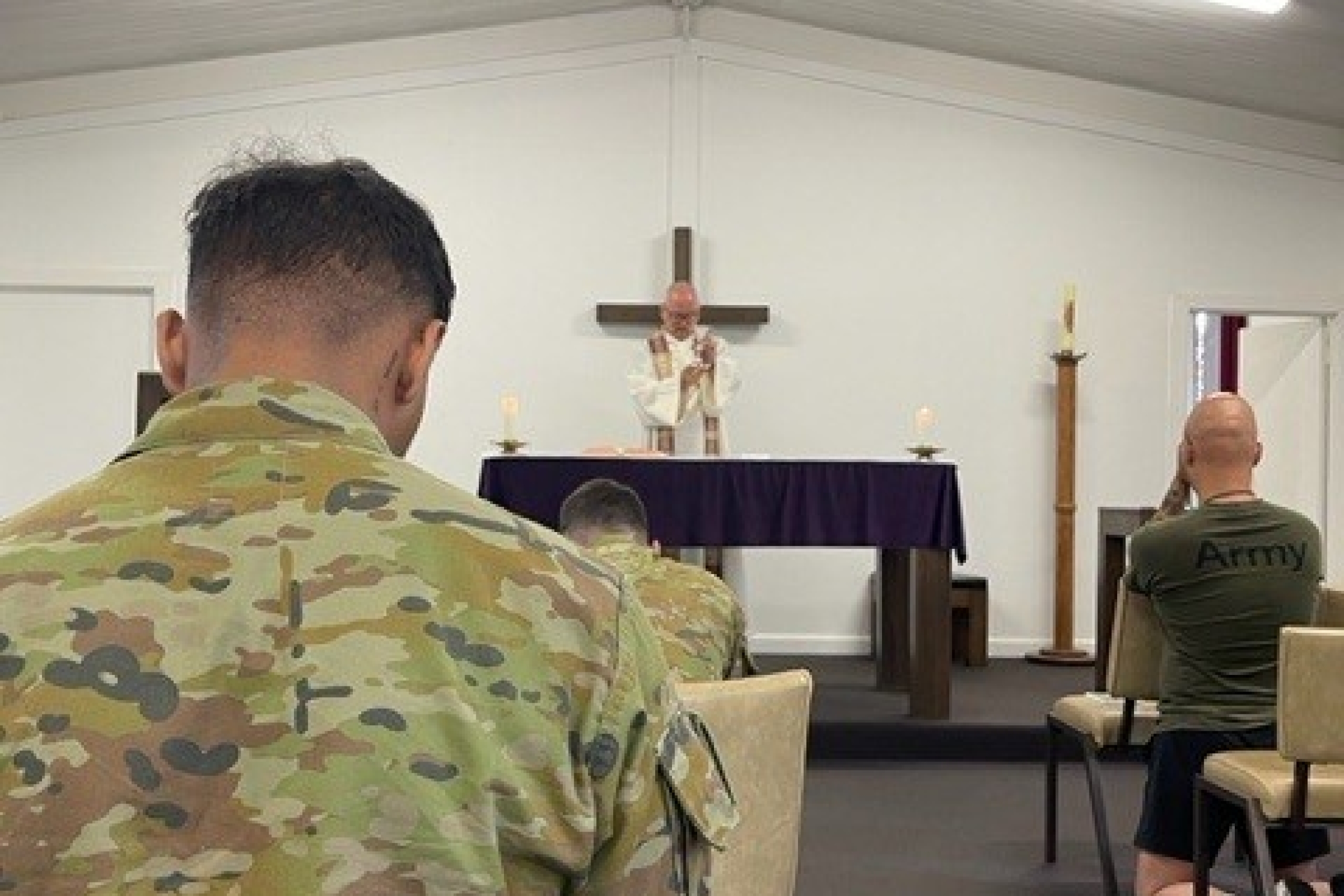 Fr Quirk saying mass at Simpson Barracks Victoria